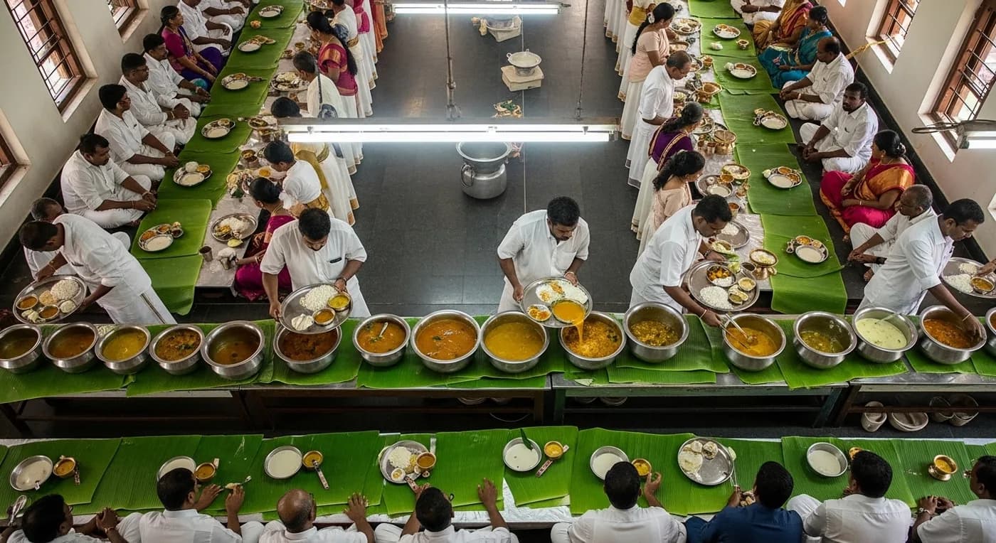 Guruvayur wedding reception with traditional sadya being served on banana leaves