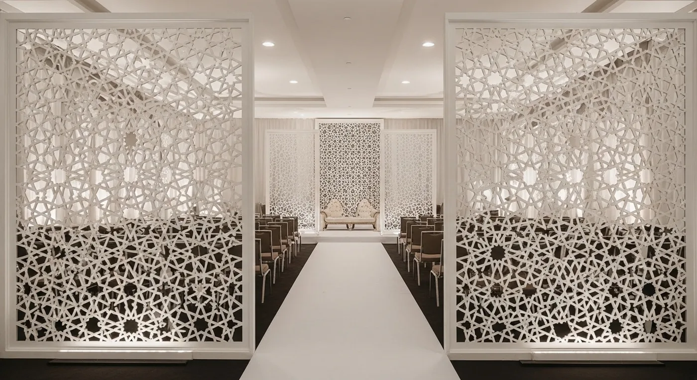 Geometric Islamic pattern panels in white and gold used as stage side screens